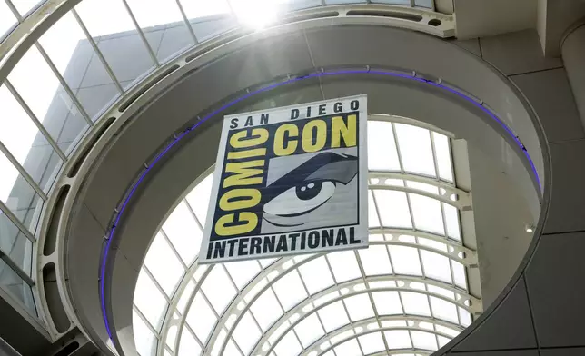 FILE - Signage appears at Comic-Con International on Thursday, July 20, 2023, in San Diego. The comic book and pop culture extravaganza, which draws over 130,000 fans annually, opens for a preview night Wednesday and runs from Thursday through Sunday. (Photo by Christy Radecic/Invision/AP, FIle)