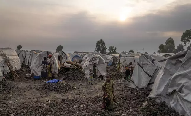 People displaced by the ongoing fighting gather at refugee camp on the outskirts of Goma, Democratic Republic of the Congo, Thursday, July 11, 2024. The top U.N. official in Congo on Monday welcomed a two-week humanitarian cease-fire in its mineral-rich east, where she said violence has reached "alarming levels" and risked provoking a wider regional conflict. (AP Photo/Moses Sawasawa)