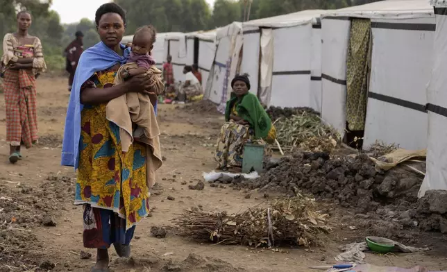 People displaced by the ongoing fighting gather at refugee camp on the outskirts of Goma, Democratic Republic of the Congo, Thursday, July 11, 2024. The top U.N. official in Congo on Monday welcomed a two-week humanitarian cease-fire in its mineral-rich east, where she said violence has reached "alarming levels" and risked provoking a wider regional conflict. (AP Photo/Moses Sawasawa)