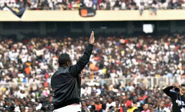 Congolese gospel singer Mike Kalambayi performs at the Stade des Martyrs of Kinshasa, Democratic Republic of Congo, Saturday, July 27, 2024. Multiple people were killed and many others were injured during a stampede at the concert, according to authorities. (AP Photo/Samy Ntumba Shambuyi)