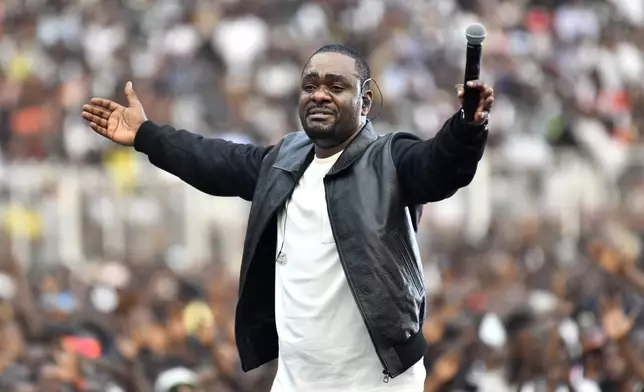 Congolese gospel singer Mike Kalambayi performs at the Stade des Martyrs of Kinshasa, Democratic Republic of Congo, Saturday, July 27, 2024. Multiple people were killed and many others were injured during a stampede at the concert, according to authorities. (AP Photo/Samy Ntumba Shambuyi)