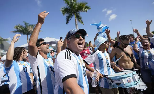 Fans of Argentina cheer for their team prior to the Copa America final soccer match against Colombia in Miami Gardens, Fla., Sunday, July 14, 2024. (AP Photo/Lynne Sladky)