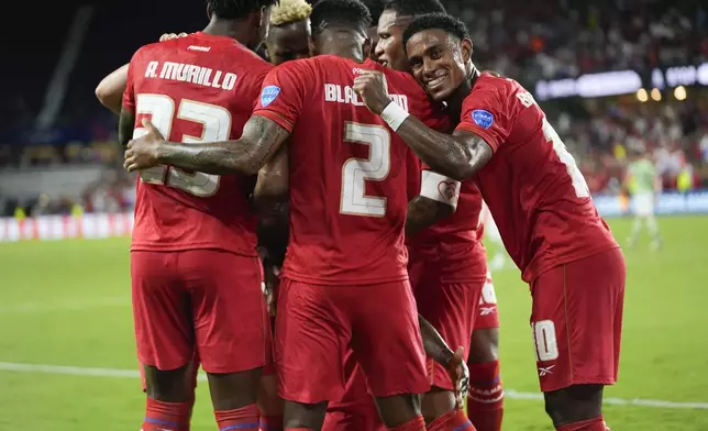 Panama's Jose Fajardo is congratulated after scoring his side's opening goal against Bolivia during a Copa America Group C soccer match in Orlando, Fla., Monday, July 1, 2024. (AP Photo/John Raoux)