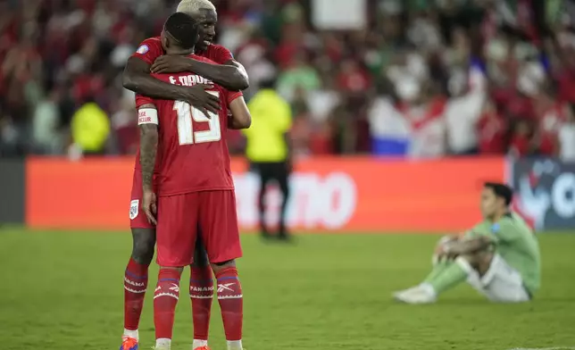 Panama's Eric Davis, front, and Jose Cordoba celebrate their team victory 3-1 over Bolivia at the end of a Copa America Group C soccer match in Orlando, Fla., Monday, July 1, 2024. (AP Photo/John Raoux)
