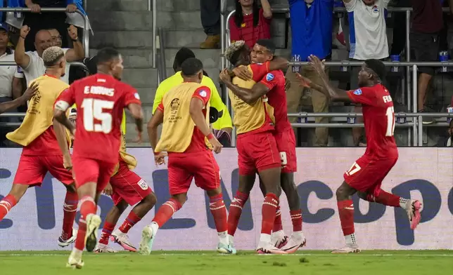 Panama's Eduardo Guerrero, second from right, is congratulated after scoring his side's 2nd goal against Bolivia during a Copa America Group C soccer match in Orlando, Fla., Monday, July 1, 2024. (AP Photo/John Raoux)