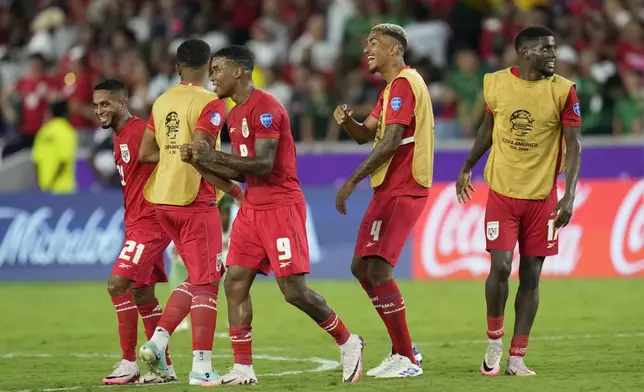 Panama's players celebrate their team victory 3-1 over Bolivia at the end of a Copa America Group C soccer match in Orlando, Fla., Monday, July 1, 2024. (AP Photo/John Raoux)