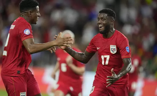 Panama's Jose Fajardo, right, celebrates scoring his side's opening goal against Bolivia during a Copa America Group C soccer match in Orlando, Fla., Monday, July 1, 2024. (AP Photo/John Raoux)