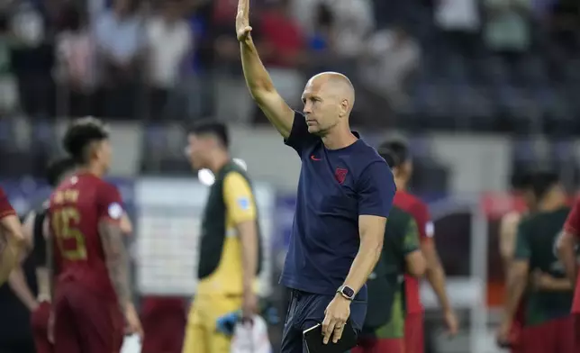 Coach Gregg Berhalter of United States celebrates his team's 2-0 victory over Bolivia at the end of a Copa America Group C soccer match in Arlington, Texas, Sunday, June 23, 2024. (AP Photo/Julio Cortez)