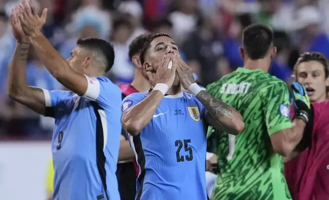 Uruguay's Cristian Olivera (25) reacts after his team defeated the United States in an Copa America Group C soccer match, Monday, July 1, 2024, in Kansas City, Mo. (AP Photo/Ed Zurga)
