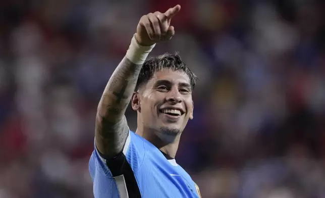 Uruguay's Mathias Olivera celebrates after his team defeated the United States in an Copa America Group C soccer match, Monday, July 1, 2024, in Kansas City, Mo. (AP Photo/Ed Zurga)