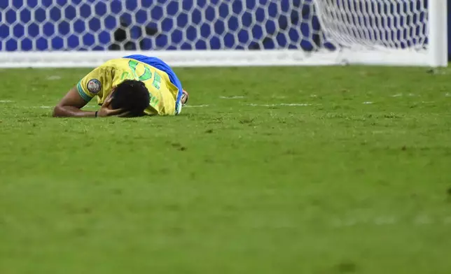 Brazil's Rodrygo grimaces in pain during a Copa America quarterfinal soccer match against Uruguay in Las Vegas, Saturday, July 6, 2024. (AP Photo/David Becker)