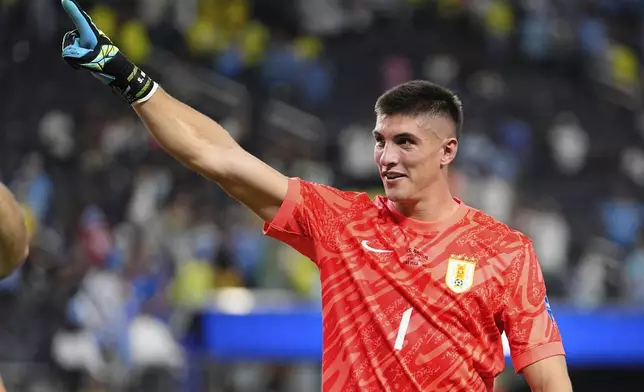 Uruguay's goalkeeper Sergio Rochet celebrares after defeating Brazil in a penalty shoot out during a Copa America quarterfinal soccer match in Las Vegas, Saturday, July 6, 2024. (AP Photo/Julio Cortez)