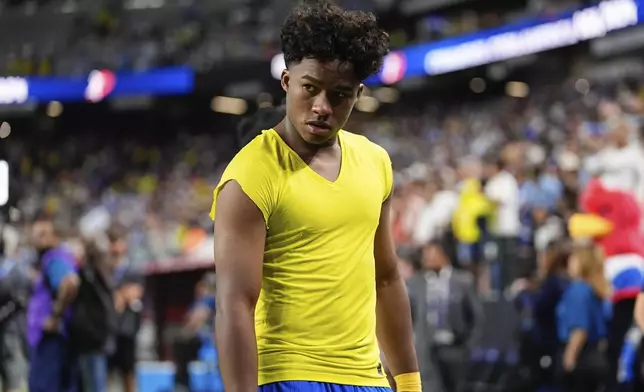 Brazil's Endrick walks off the field after his side's lost against Uruguay in a Copa America quarterfinal soccer match in Las Vegas, Saturday, July 6, 2024. (AP Photo/Julio Cortez)