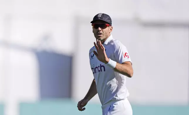 FILE - England's James Anderson gestures to the crowd after taking his 700th wicket on the third day of the fifth and final test match between England and India in Dharamshala, India, Saturday, March 9, 2024. James Anderson has “made peace” with his impending England retirement — even if the evergreen seamer believes he is bowling as well as he ever has done. (AP Photo /Ashwini Bhatia, File)