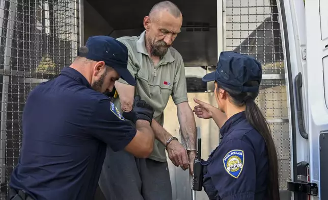 Detained suspect retired military police officer Kresimir Pahoki is assisted by police as he is transferred for interrogation in Bjelovar, central Croatia, Tuesday, July 23, 2024. The suspected gunman in a mass shooting at a nursing home in Croatia is facing 11 criminal charges, including murder, after he was accused of killing six people, including his own mother, and wounding as many more, police said on Tuesday. (Damir Krajac/Cropix via AP)