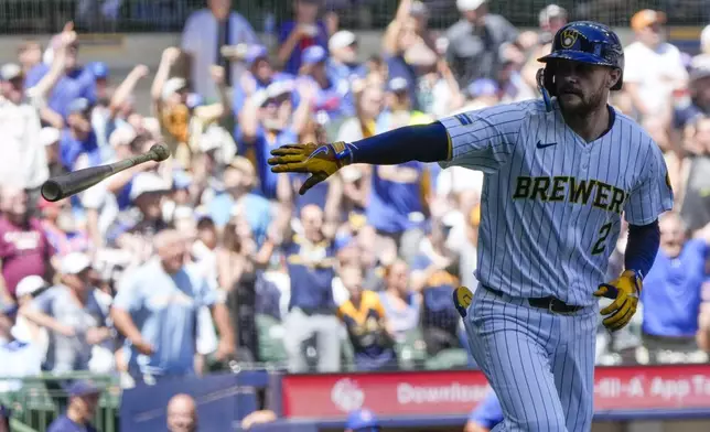 Milwaukee Brewers' Brice Turang tosses his bat after hitting a grand slam during the fourth inning of a baseball game against the Chicago Cubs Sunday, June 30, 2024, in Milwaukee. (AP Photo/Morry Gash)