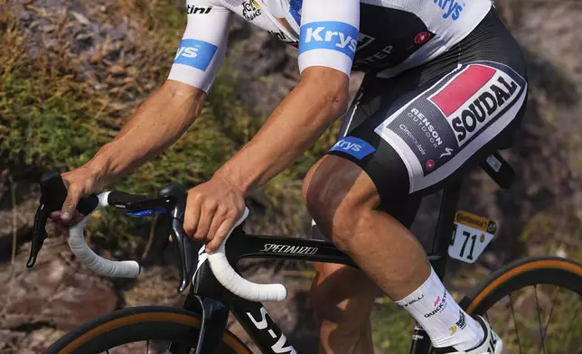 Belgium's Remco Evenepoel, wearing the best young rider's white jersey, rides during the twentieth stage of the Tour de France cycling race over 132.8 kilometers (82.5 miles) with start in Nice and finish in La Couillole pass, France, Saturday, July 20, 2024. (AP Photo/Daniel Cole)