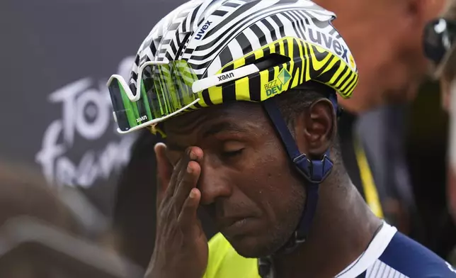 Stage winner Eritrea's Biniam Girmay reacts after the third stage of the Tour de France cycling race over 230.8 kilometers (143.4 miles) with start in Piacenza and finish in Turin, Italy, Monday, July 1, 2024. (AP Photo/Daniel Cole)