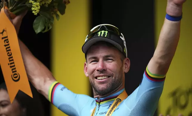 Britain's sprinter Mark Cavendish celebrates his record 35th Tour de France stage win to break the record of Belgian legend Eddy Merckx in the fifth stage of the Tour de France cycling race over 177.4 kilometers (110.2 miles) with start in Saint-Jean-de-Maurienne and finish in Saint-Vulbas, France, Wednesday, July 3, 2024. (AP Photo/Daniel Cole)