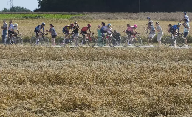 France's David Gaudu leads before Ireland's Ben Healy, France's Anthony Turgis, Britain's Thomas Pidcock. Belgium's Jasper Stuyven, Canada's Hugo Houle and Spain's Alex Aranburu during the ninth stage of the Tour de France cycling race over 199 kilometers (123.7 miles) with start and finish in Troyes, France, Sunday, July 7, 2024. (AP Photo/Jerome Delay)