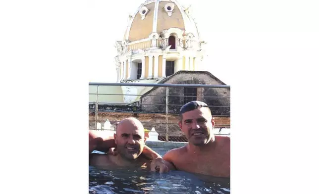 This October 2014 photo obtained by The Associated Press shows then-U.S. Drug Enforcement Administration Agents Jose Irizarry and George Zoumberos in a rooftop pool at a luxury hotel in Cartagena, Colombia, during a DEA assignment for "Operation White Wash." Irizarry long considered Zoumberos a brother but in his interviews with investigators accused his former partner of a list of crimes. (AP Photo)