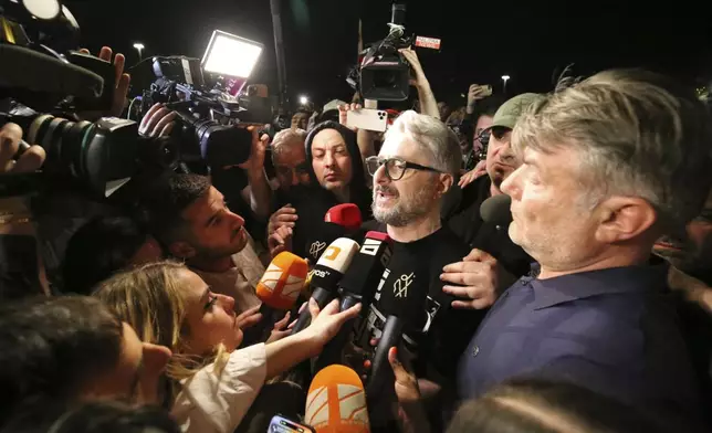 FILE Nika Gvaramia, a Georgian politician and the founder of the Ahali party and Mtavari TV, one of the biggest TV media outlets in the country, speaks to journalists during a rally outside the parliament building in Tbilisi, Georgia, on April 17, 2024, to protest against "the Russian law" similar to a law that Russia uses to stigmatize independent news media and organizations seen as being at odds with the Kremlin. Thousands of people rallied in Georgia for weeks against the foreign influence bill. Critics compared it to similar legislation Russia uses to stifle dissent, and they worried it would jeopardize Georgia's prospects of joining the European Union. (AP Photo/Zurab Tsertsvadze, File)