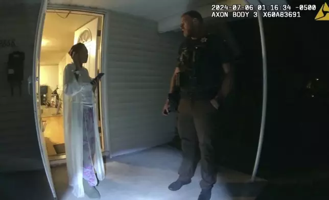 In this image taken from body camera video released by Illinois State Police, Sonya Massey, left, talks with former Sangamon County Sheriff’s Deputy Sean Grayson outside her home in Springfield, Ill., July 6, 2024. Footage released Monday, July 22, by a prosecutor reveals a chaotic scene in which Massey, who called 911 for help, is shot in the face in her home by Grayson. (Illinois State Police via AP)