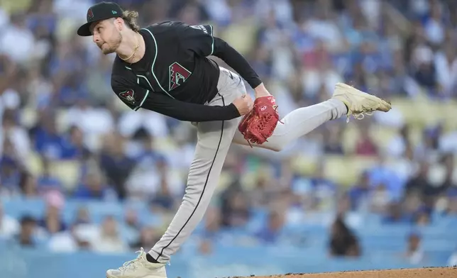 Arizona Diamondbacks relief pitcher Ryne Nelson follows through on a pitch during the first inning of a baseball game against the Los Angeles Dodgers, Tuesday, July 2, 2024, in Los Angeles. (AP Photo/Ryan Sun)