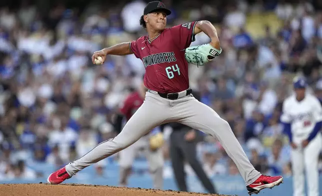Arizona Diamondbacks starting pitcher Cristian Mena throws to the plate during the first inning of a baseball game against the Los Angeles Dodgers Wednesday, July 3, 2024, in Los Angeles. (AP Photo/Mark J. Terrill)