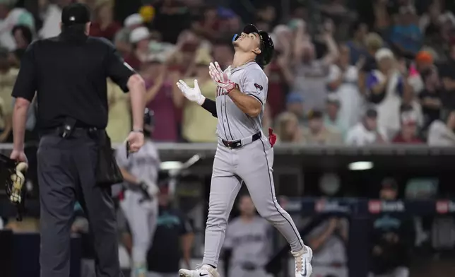 Arizona Diamondbacks' Alek Thomas celebrates after hitting a grand slam during the ninth inning of a baseball game against the San Diego Padres, Friday, July 5, 2024, in San Diego. (AP Photo/Gregory Bull)