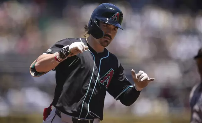 Arizona Diamondbacks' Corbin Carroll celebrates after hitting a home run during the first inning of a baseball game against the San Diego Padres, Sunday, July 7, 2024, in San Diego. (AP Photo/Gregory Bull)