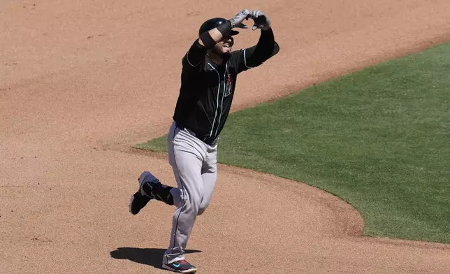 Arizona Diamondbacks' Eugenio Suarez celebrates after hitting a two-run home run during the seventh inning of a baseball game against the San Diego Padres, Sunday, July 7, 2024, in San Diego. (AP Photo/Gregory Bull)