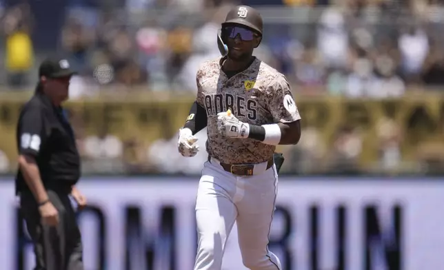 San Diego Padres' Jurickson Profar rounds the bases after hitting a home run during the first inning of a baseball game against the Arizona Diamondbacks, Sunday, July 7, 2024, in San Diego. (AP Photo/Gregory Bull)