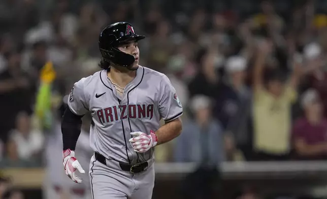 Arizona Diamondbacks' Alek Thomas watches his grand slam during the ninth inning of a baseball game against the San Diego Padres, Friday, July 5, 2024, in San Diego. (AP Photo/Gregory Bull)