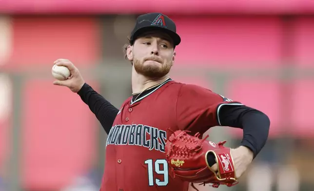 Arizona Diamondbacks pitcher Ryne Nelson throws from the mound against a Kansas City Royals batter during the first inning of a baseball game in Kansas City, Mo., Wednesday, July 24, 2024. (AP Photo/Colin E. Braley)