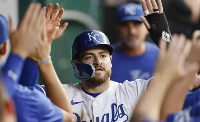 Kansas City Royals' Kyle Isbel celebrates in the dugout after scoring on a wild pitch from Arizona Diamondbacks pitcher Ryne Nelson during the fourth inning of a baseball game in Kansas City, Mo., Wednesday, July 24, 2024. (AP Photo/Colin E. Braley)