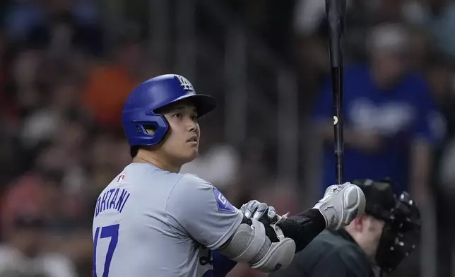 Los Angeles Dodgers designated hitter Shohei Ohtani bats during the sixth inning of a baseball game against the Houston Astros, Friday, July 26, 2024, in Houston. (AP Photo/Kevin M. Cox)