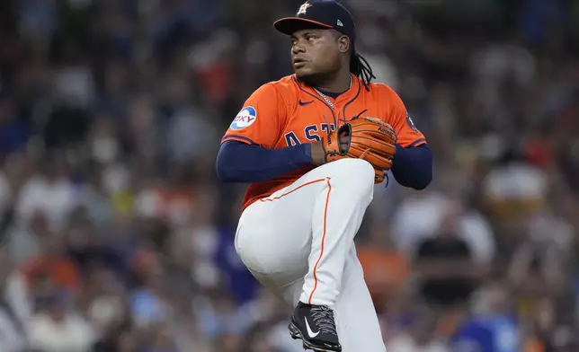 Houston Astros starting pitcher Framber Valdez delivers during the first inning of a baseball game against the Los Angeles Dodgers, Friday, July 26, 2024, in Houston. (AP Photo/Kevin M. Cox)