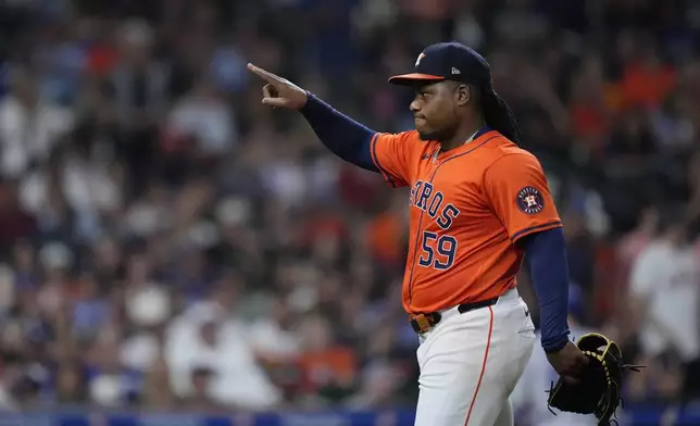 Houston Astros starting pitcher Framber Valdez walks off the mound during the middle of the fifth inning of a baseball game against the Los Angeles Dodgers, Friday, July 26, 2024, in Houston. (AP Photo/Kevin M. Cox)