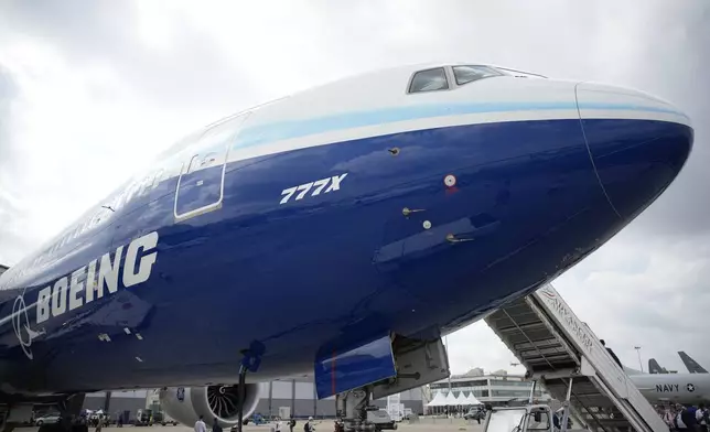 FILE - The Boeing 777X airplane is shown during the Paris Air Show in Le Bourget, north of Paris, France, June 19, 2023. Boeing said Wednesday, July 31, 2024, that aerospace industry veteran Robert "Kelly" Ortberg will take over as CEO next week, replacing David Calhoun. Boeing is announcing the new CEO as it reports a loss of more than $1.4 billion in the second quarter. (AP Photo/Lewis Joly, File)