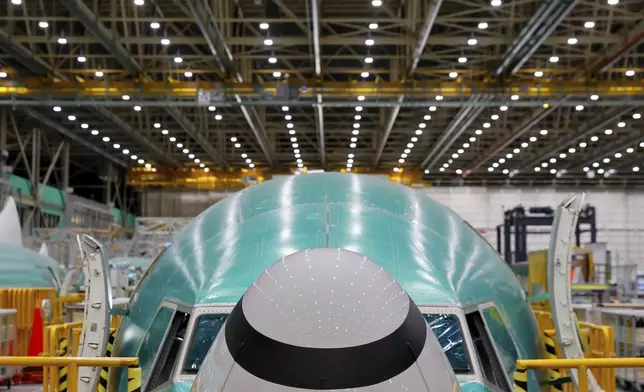 FILE - A Boeing 737 MAX aircraft is shown on the assembly line during a media tour at the Boeing facility in Renton, Wash., on June 25, 2024. Boeing said Wednesday, July 31, 2024, that aerospace industry veteran Robert "Kelly Ortberg will take over as CEO next week, replacing David Calhoun. Boeing is announcing the new CEO as it reports a loss of more than $1.4 billion in the second quarter. (Jennifer Buchanan/The Seattle Times via AP, Pool, File)