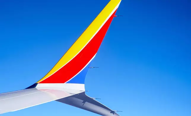 FILE - A Southwest Airlines 737 Max 8 airplane flies, Feb. 9, 2024, in Atlanta. Southwest reports earnings on Thursday, July 25, 2024. (AP Photo/Mike Stewart, File)