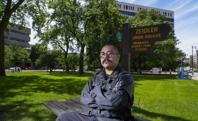 Omar Flores poses for a picture in Zeidler Union Square Monday, July 1, 2024, in Milwaukee. (AP Photo/Morry Gash)