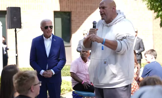 Sen. John Fetterman, D-Pa., speaks as President Joe Biden, left, listens at a campaign rally in Harrisburg, Pa., on Sunday, July 7, 2024. (AP Photo/Manuel Balce Ceneta)