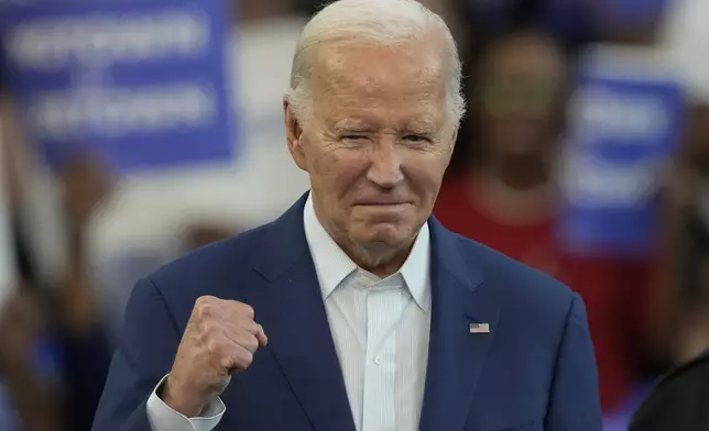 President Joe Biden is gesturing before speaking at a campaign event at Renaissance High School, Friday, July 12, 2024, in Detroit. (AP Photo/Carlos Osorio)