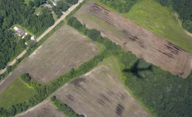 The shadow of Air Force One with President Joe Biden aboard is pictured as it approaches Detroit Metropolitan Wayne County Airport in Detroit, Friday July 12, 2024, for a campaign event. (AP Photo/Jacquelyn Martin)