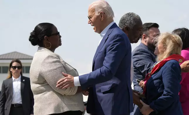 President Joe Biden, right, is greeted by Octavia Spencer upon arriving at Detroit Metropolitan Wayne County Airport in Detroit, Friday July 12, 2024, for a campaign event. (AP Photo/Jacquelyn Martin)