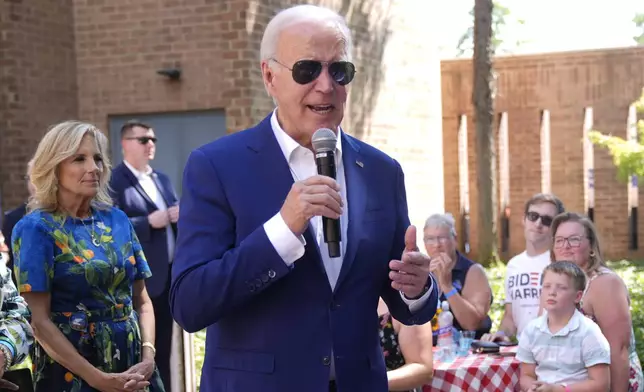 President Joe Biden speaks to supporters as first lady Jill Biden, left, looks on at a campaign rally in Harrisburg, Pa., on Sunday, July 7, 2024. (AP Photo/Manuel Balce Ceneta)