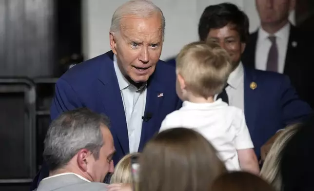 President Joe Biden greets supporters at Garage Grill &amp; Fuel Bar during a campaign stop in Northville, Mich., Friday July 12, 2024. (AP Photo/Jacquelyn Martin)