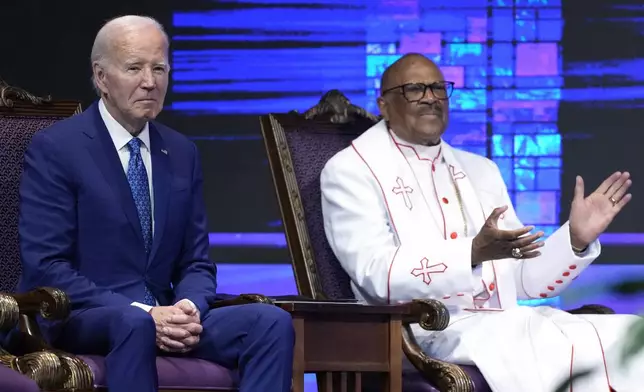 President Joe Biden, left, and Bishop Ernest C. Morris, Sr., sit during a church service at Mt. Airy Church of God in Christ, Sunday, July 7, 2024, in Philadelphia (AP Photo/Manuel Balce Ceneta)